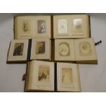 Four Victorian brass mounted leather photograph albums containing a large selection of carte de