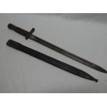 A Portuguese Artillery bayonet with single edged blade in steel mounted leather scabbard