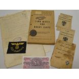 A selection of various Second War paperwork and badges including original German unissued "RBD