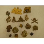 A selection of military badges including gilt Household Cavalry pouch badge,