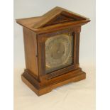 A 19th century German mantel clock with brass and silvered square dial in polished walnut