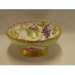 A good quality French china circular bowl with grape and leaf decoration,