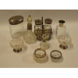 A selection of various silver mounted toiletry bottles, a pair of silver mounted circular salts,