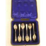 A set of six George V silver teaspoons with decorated handles,
