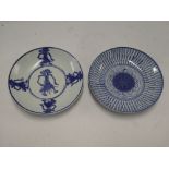 Two 19th century Japanese pottery circular shallow dishes with blue and white decoration,