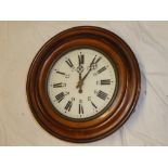 An old wall clock with circular enamelled dial in polished mahogany and brass mounted circular case