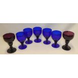 A pair of 19th century amethyst tinted glass goblets 6" high and five similar 20th century Bristol