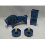 A 1960's blue and turquoise glazed figure of a bull 12" long;