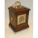 A good quality chiming bracket clock with gilt and silvered square dial in brass mounted oak