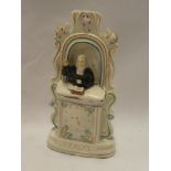 A Victorian Staffordshire pottery figure of Wesley preaching from a pulpit,