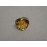 A 1981 gold 1/10th Krugerrand coin, clip-mounted in a 9ct gold signet ring mount (8.