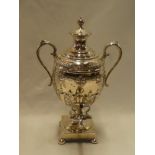 A good quality silver-plated two-handled baluster-shaped samovar with raised floral decoration and