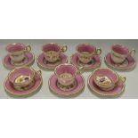 A Victorian china part tea and coffee set with floral and pink decoration comprising five coffee