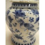 A 19th century Chinese tapered vase and cover with blue and white floral decoration,