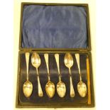 A set of six George V silver teaspoons with engraved handles Sheffield marks 1917 in velvet lined