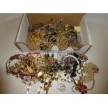 A large selection of various costume jewellery including necklaces, brooches, earrings,