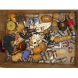 A large collection of various sewing items including numerous silver and other thimbles,