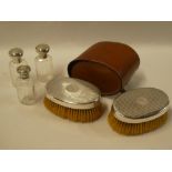 A pair of gentlemen's George V silver backed brushes,