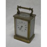 A French carriage clock with rectangular enamelled dial in brass traditional case