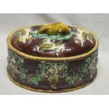 A Wedgwood majolica glazed oval game tureen and cover decorated in relief with dead game,