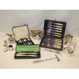 A selection of various silver-plated items including unusual bottle warming stand,