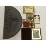 An unusual Victorian leather-bound and brass mounted semi-circular family photograph album and a