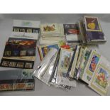 A selection of over 80 GB stamp presentation packs,