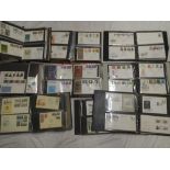 Nine folder albums containing a large selection of mainly GB first day covers