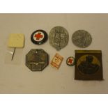 A selection of Second War German Day badges and others including two German Red Cross lapel badges,