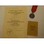 A Second War German Eastern Front 1941-1942 medal with packet of issue and original certificate