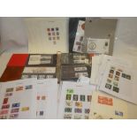 Two albums of GB presentation packs together with various GB stamps on album pages etc.