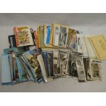 A selection of various black and white and coloured postcards, souvenir booklets,