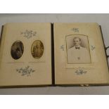 A Victorian brass mounted leather family photograph album containing a selection of over fifty