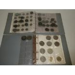 Two albums containing a selection of mixed GB coins including some silver 3d coins,