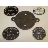 Five various cast-iron railway wagon plates including "Standard 14 Tons" dated 1944;