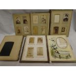 Three Victorian family photograph albums containing over 100 various carte de vistes and cabinet
