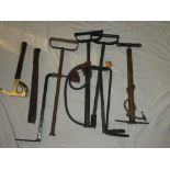 A Second War Axe, a machete dated 1945, a selection of ARP stirrup pumps etc.