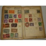 An old album containing a mixed selection of World stamps
