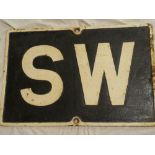 An old Great Western Railway cast-iron rectangular railway sign "SW" (sound whistle),