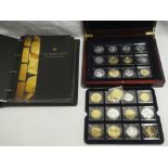 A selection of 25 "Millionaires Collection" cased coins from varying ages in fitted mahogany case,