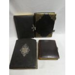 Four good quality empty Victorian leather bound family photograph albums with decorative clasps