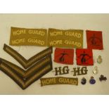 A selection of Second War Home Guard insignia including two pairs of uncut printed Home Guard