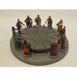 A Sculptures UK Knights of the Round Table figure comprising round table with base and 11 knights,
