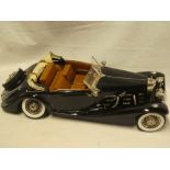 A large scale model of a 1920's/30's Mercedes open sports car,
