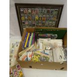 A selection of various collectables including postcard catalogues, albums of tea cards,