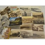 A small selection of various black and white and coloured postcards including photographic Poldhu