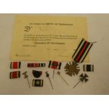A First War German 1914-1918 Cross of Honour with swords and original certificate dated 1939;