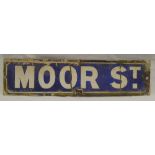 A rectangular blue and white enamelled street sign "Moor St.