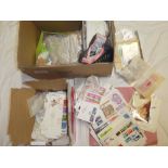 A box containing numerous GB first day covers, postal covers, mint stamps, stamps in packets,