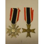 A Second War German War Merit Cross with swords dated 1939 and a Second War German War Merit Cross